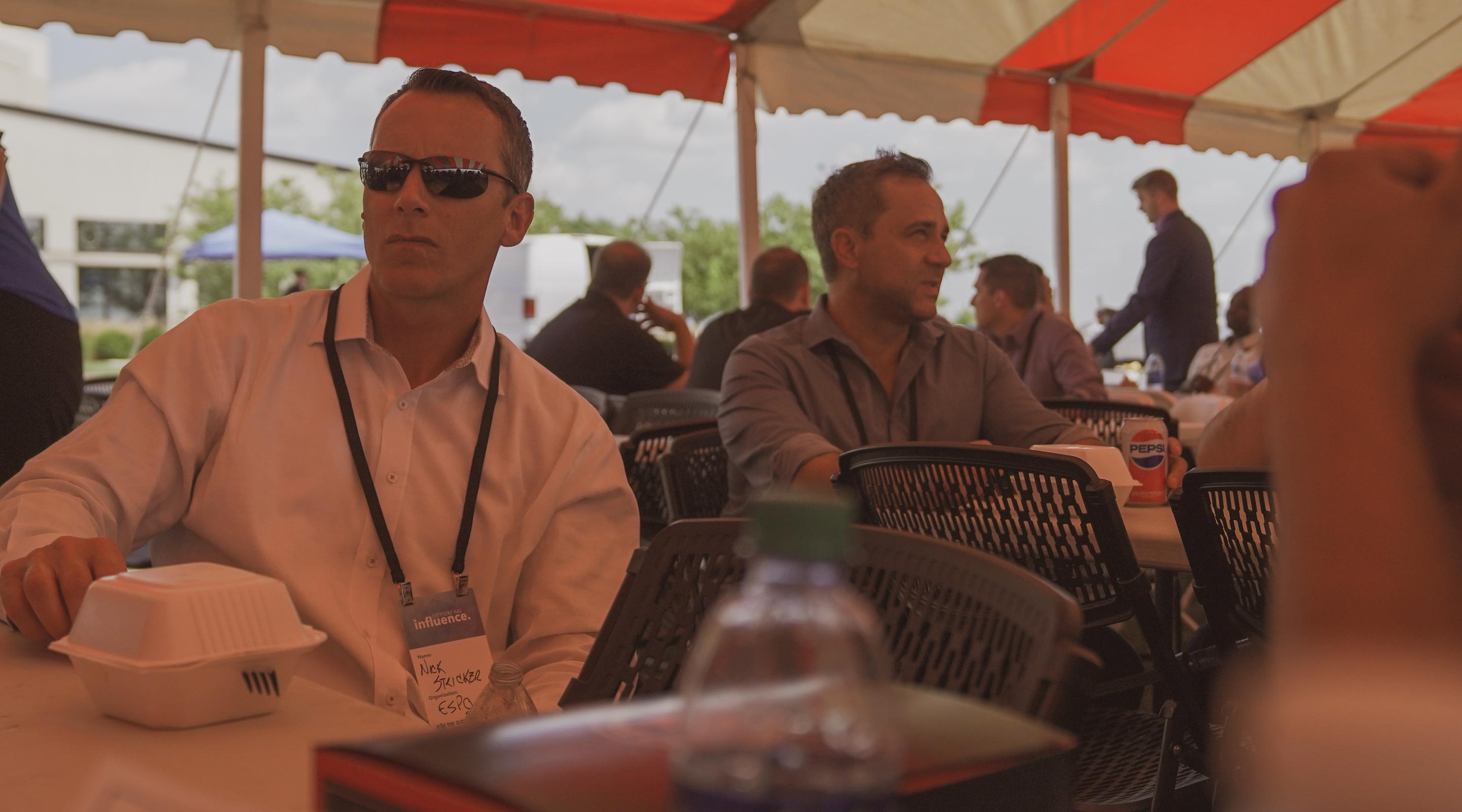 Two team members talking at an outdoor company event