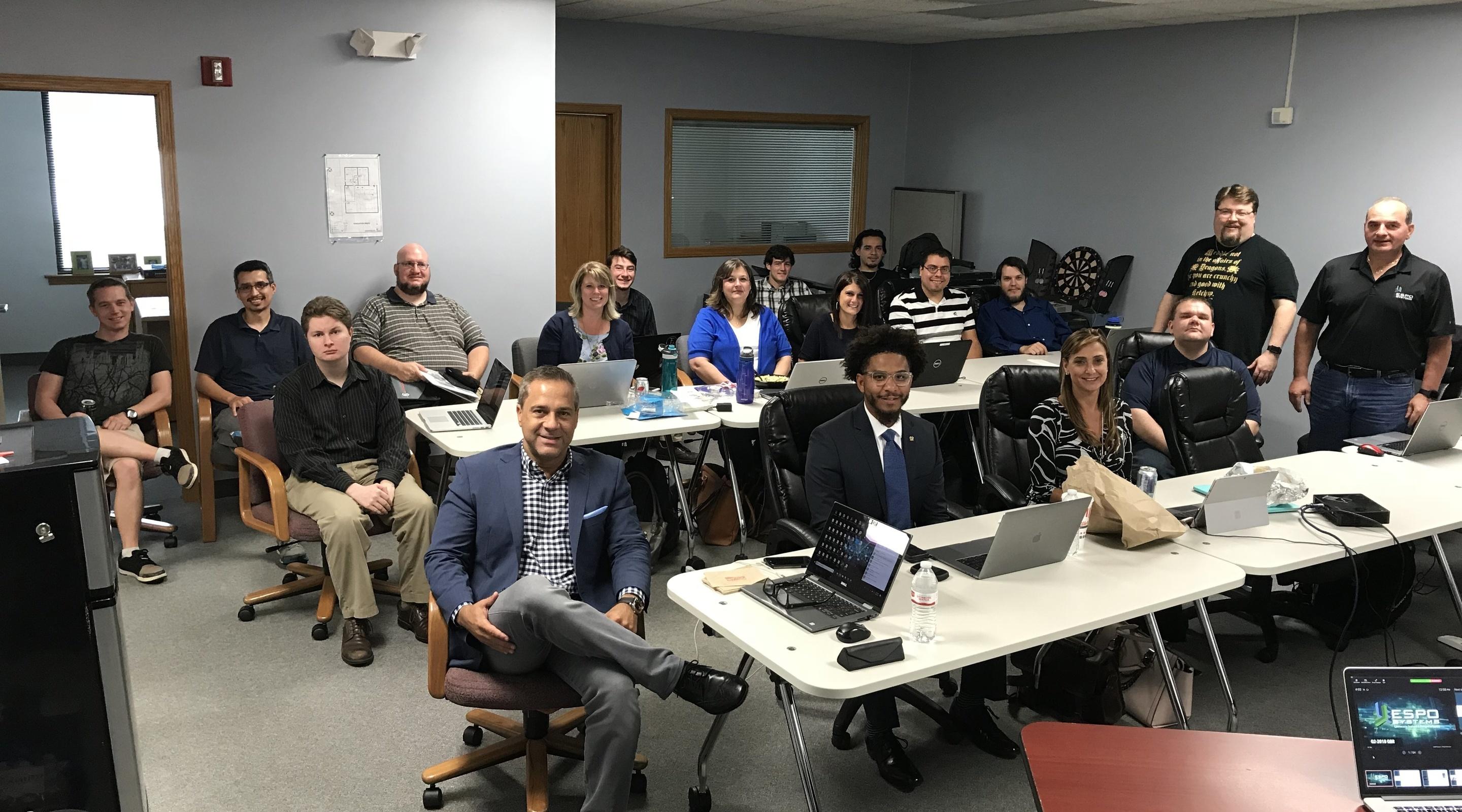 The ES Cyber team gathered in a training room for a team training day
